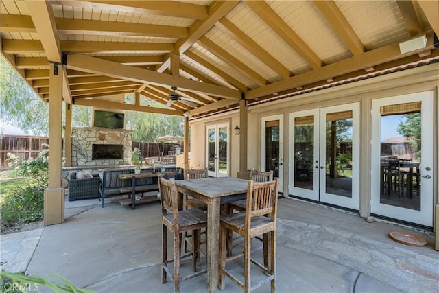 36702 Doreen Dr, Murrieta, CA 92563 - view of patio with french doors, an outdoor stone fireplace, outdoor dining space, and ceiling fan