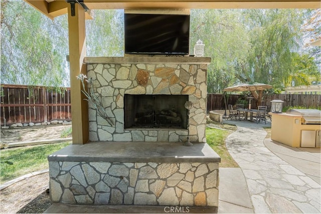 36702 Doreen Dr, Murrieta, CA 92563 - fenced backyard with an outdoor stone fireplace, a patio, and grilling area