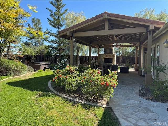 36702 Doreen Dr, Murrieta, CA 92563 - view of yard with an outdoor stone fireplace, a hot tub, and a patio area