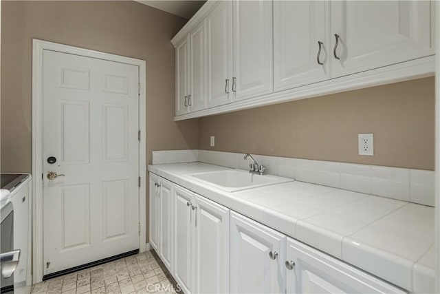 36702 Doreen Dr, Murrieta, CA 92563 - washroom featuring cabinet space, washer and dryer, and light flooring
