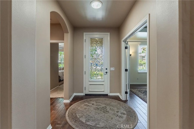 36702 Doreen Dr, Murrieta, CA 92563 - entryway with arched walkways, dark wood-style flooring, plenty of natural light, and baseboards