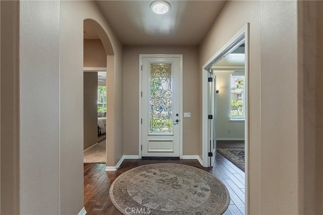 36702 Doreen Dr, Murrieta, CA 92563 - entrance foyer with arched walkways, dark wood-style floors, and plenty of natural light