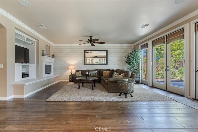 36702 Doreen Dr, Murrieta, CA 92563 - living area with hardwood / wood-style flooring, ornamental molding, a glass covered fireplace, ceiling fan, and baseboards