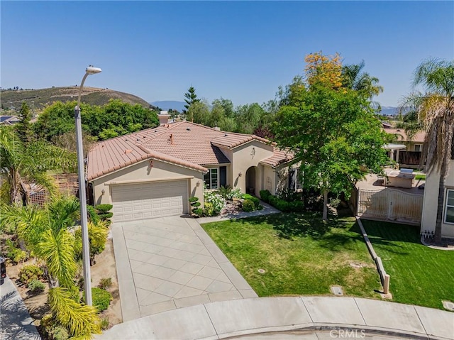 36702 Doreen Dr, Murrieta, CA 92563 - mediterranean / spanish-style house with a tile roof, an attached garage, stucco siding, driveway, and a front yard