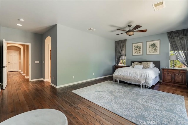 36702 Doreen Dr, Murrieta, CA 92563 - bedroom featuring arched walkways, dark wood-style flooring, baseboards, and ceiling fan