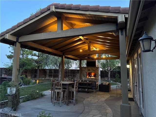 36702 Doreen Dr, Murrieta, CA 92563 - fenced backyard featuring an outdoor stone fireplace, a patio area, and a gazebo