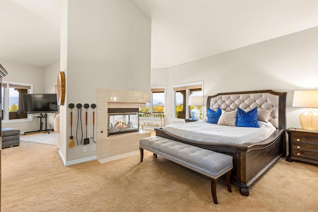 9698 Welk View Dr, Escondido, CA 92026 - carpeted bedroom with high vaulted ceiling and a tiled fireplace