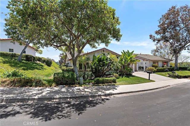 27972 Via Chocano, Mission Viejo, CA 92692 - obstructed view of property featuring stucco siding and driveway
