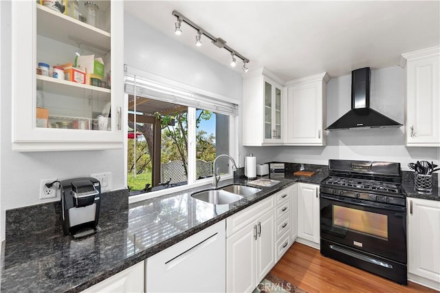 27972 Via Chocano, Mission Viejo, CA 92692 - kitchen with wall chimney range hood, gas stove, a sink, white cabinetry, and glass insert cabinets