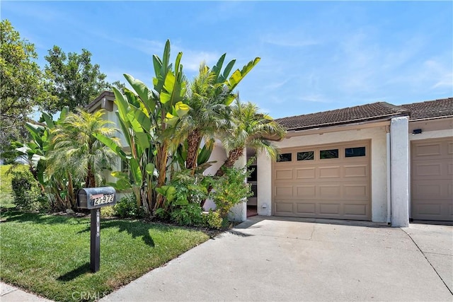 27972 Via Chocano, Mission Viejo, CA 92692 - view of front of home with a front yard, stucco siding, concrete driveway, and a tiled roof
