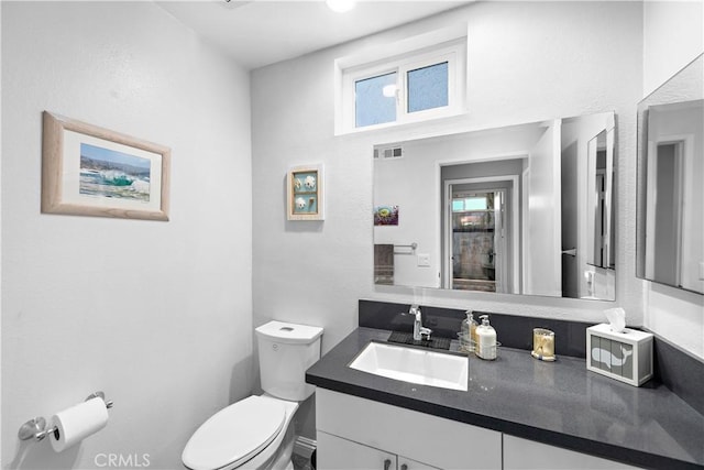 27972 Via Chocano, Mission Viejo, CA 92692 - half bathroom featuring toilet, vanity, and plenty of natural light