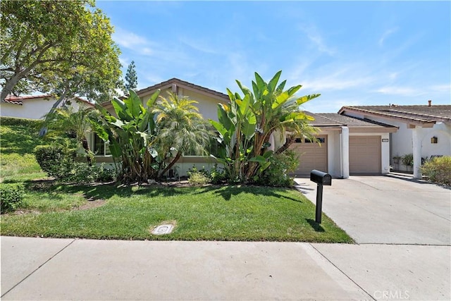 27972 Via Chocano, Mission Viejo, CA 92692 - view of front of property featuring a garage, concrete driveway, a front yard, and stucco siding