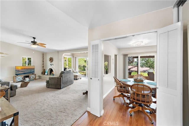 27972 Via Chocano, Mission Viejo, CA 92692 - living area with a large fireplace, plenty of natural light, a ceiling fan, and vaulted ceiling