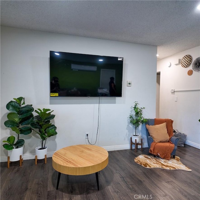 9754 5th Ave, Hesperia, CA 92345 - sitting room featuring wood finished floors, a textured ceiling, and baseboards