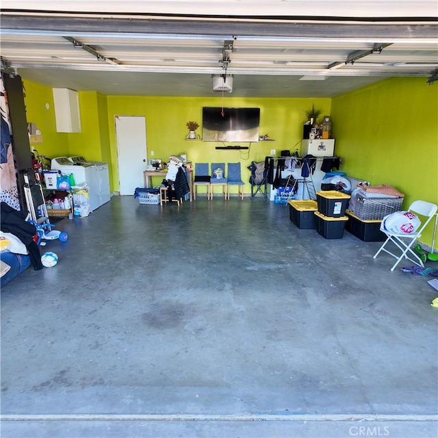 9754 5th Ave, Hesperia, CA 92345 - garage featuring washing machine and dryer and a garage door opener