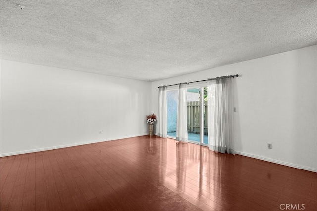 2300 S Hacienda Blvd Unit F8, Hacienda Heights, CA 91745 - empty room with wood finished floors, a textured ceiling, and baseboards