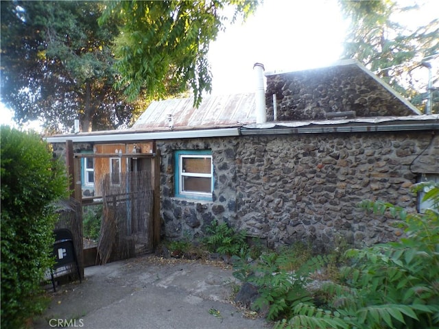 3688 Koloko St, Clearlake, CA 95422 - rear view of property featuring stone siding