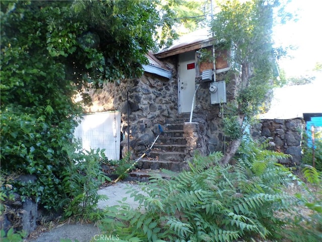 3688 Koloko St, Clearlake, CA 95422 - doorway to property featuring stone siding