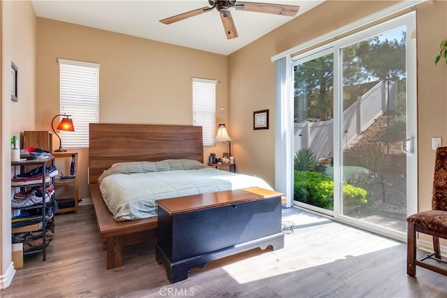 10460 Meadow Lark Ave, Moreno Valley, CA 92557 - bedroom with wood finished floors, access to exterior, and multiple windows