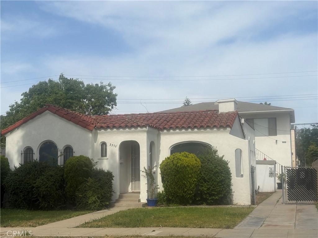 33703372 Lemon Ave Unit 2, Signal Hill, CA 90755 - mediterranean / spanish home featuring a tile roof and stucco siding