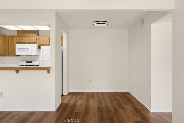 13115 Le Parc, Chino Hills, CA 91709 - kitchen with white microwave, range, dark wood-style floors, and light countertops