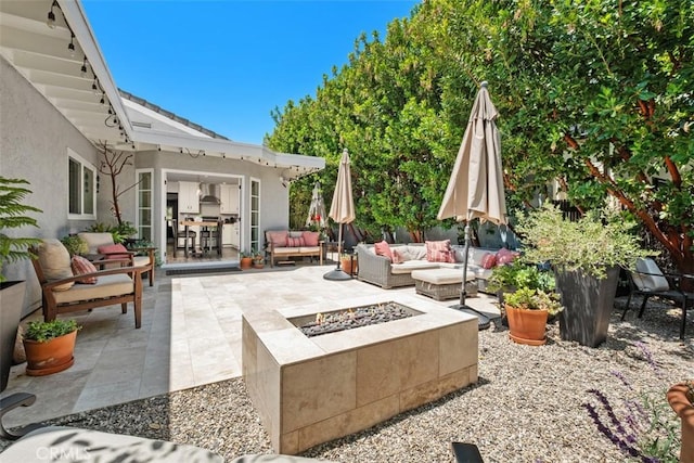 19172 Sierra Maria Rd, Irvine, CA 92603 - view of patio with an outdoor living space with a fire pit