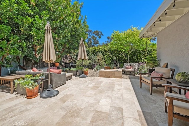 19172 Sierra Maria Rd, Irvine, CA 92603 - view of patio with an outdoor living space with a fire pit