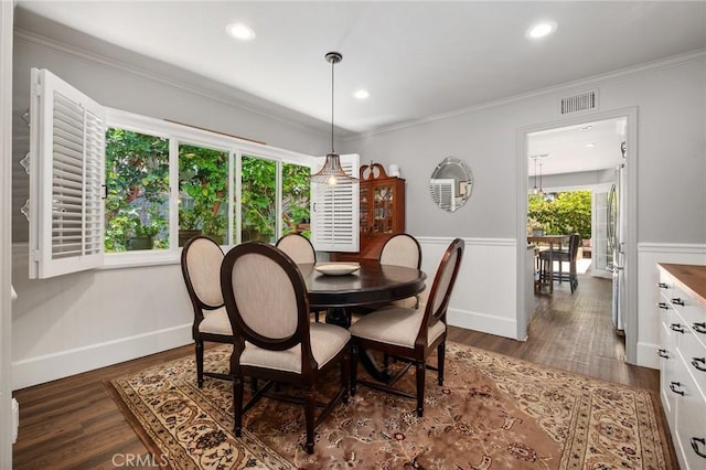 19172 Sierra Maria Rd, Irvine, CA 92603 - dining space featuring a wainscoted wall, dark wood finished floors, recessed lighting, ornamental molding, and baseboards