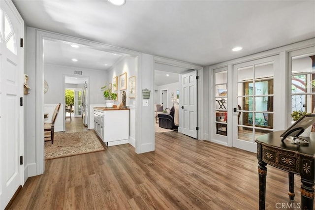 19172 Sierra Maria Rd, Irvine, CA 92603 - foyer featuring wood finished floors, french doors, recessed lighting, crown molding, and baseboards