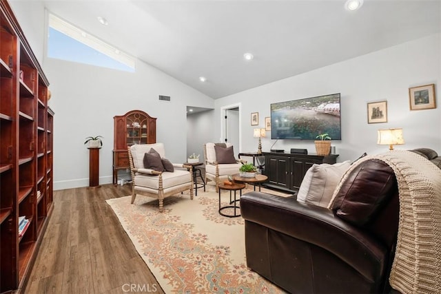 19172 Sierra Maria Rd, Irvine, CA 92603 - living room featuring wood finished floors, recessed lighting, high vaulted ceiling, and baseboards