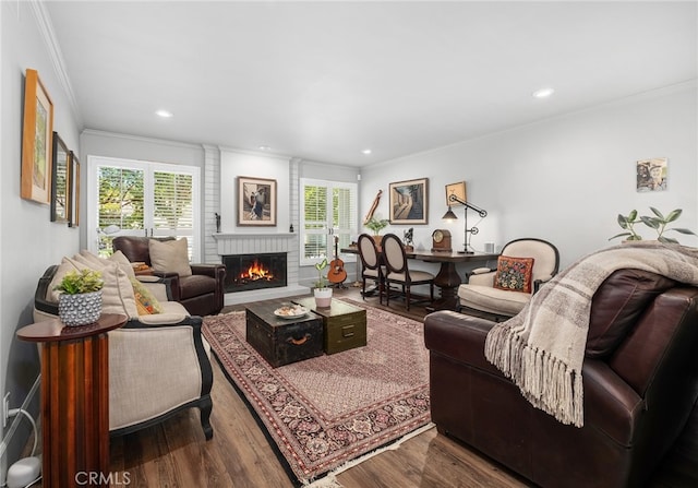 19172 Sierra Maria Rd, Irvine, CA 92603 - living area featuring ornamental molding, a fireplace, wood finished floors, and recessed lighting