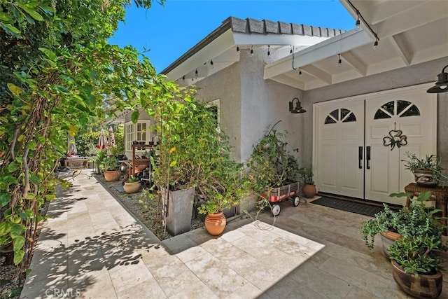 19172 Sierra Maria Rd, Irvine, CA 92603 - entrance to property featuring stucco siding and a patio