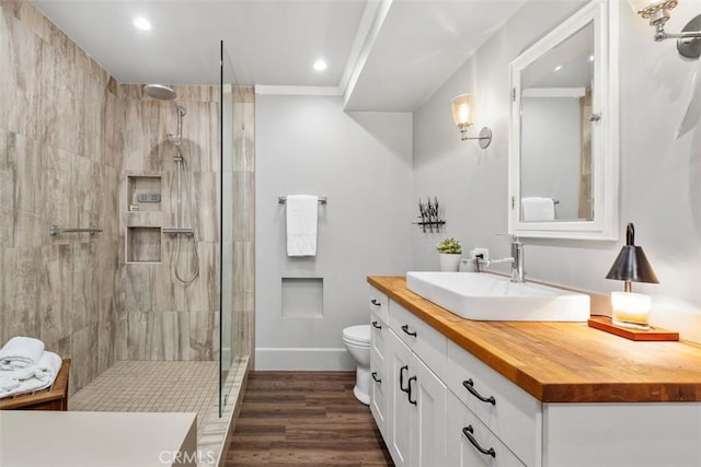 19172 Sierra Maria Rd, Irvine, CA 92603 - full bathroom with vanity, walk in shower, toilet, wood finished floors, and recessed lighting