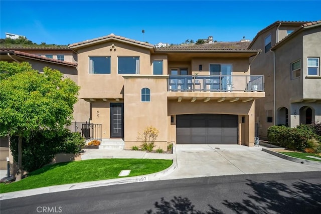 997 Canyon Ln, Pismo Beach, CA 93449 - view of front facade with a balcony, stucco siding, a garage, and concrete driveway