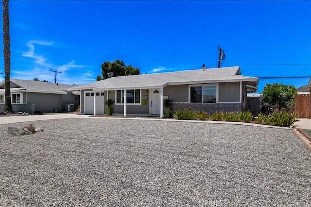 28799 Murrieta Rd, Menifee, CA 92586 - single story home featuring a garage, central AC unit, and driveway