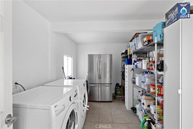28799 Murrieta Rd, Menifee, CA 92586 - laundry area with separate washer and dryer and light tile patterned floors