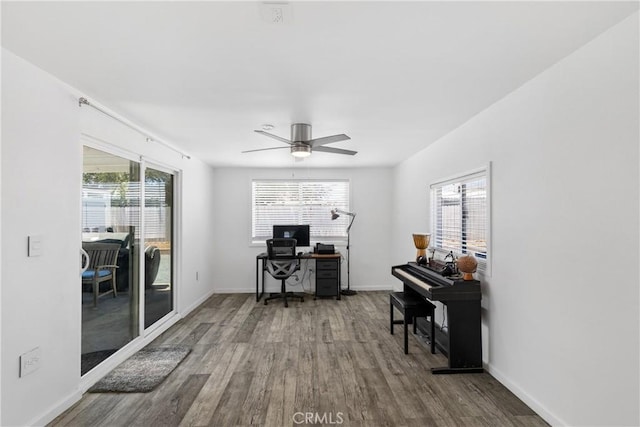 28799 Murrieta Rd, Menifee, CA 92586 - home office featuring wood finished floors, plenty of natural light, a ceiling fan, and baseboards