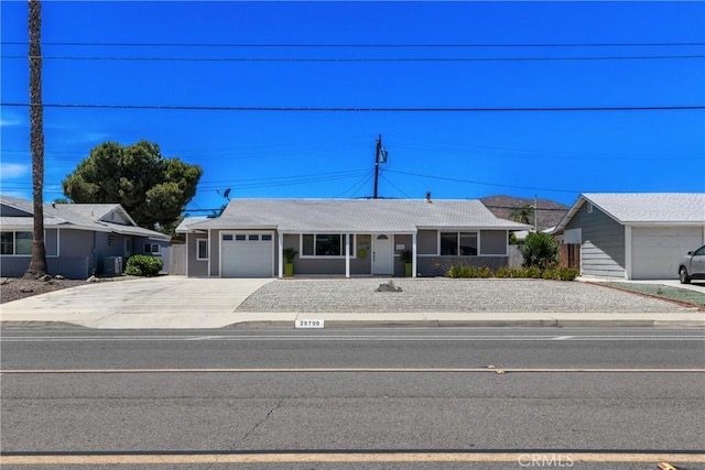 28799 Murrieta Rd, Menifee, CA 92586 - ranch-style house featuring concrete driveway and an attached garage