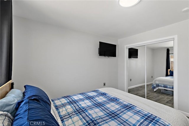 28799 Murrieta Rd, Menifee, CA 92586 - bedroom with a closet, baseboards, and wood finished floors