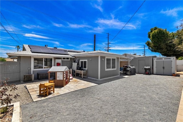 28799 Murrieta Rd, Menifee, CA 92586 - rear view of house featuring roof mounted solar panels and a patio