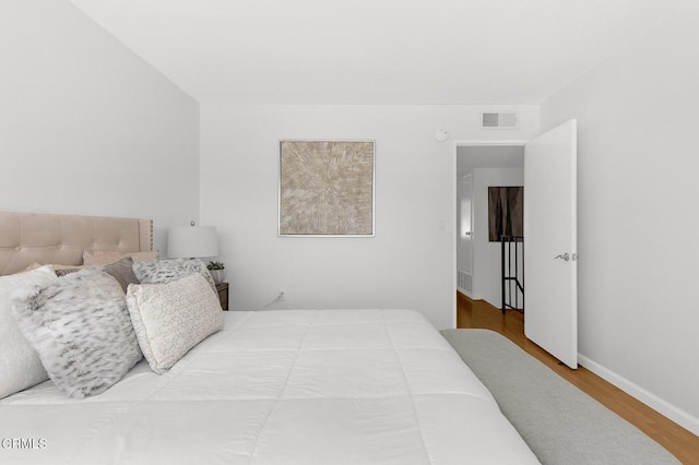 10801 Blix St Unit 2, Toluca Lake, CA 91602 - bedroom featuring wood finished floors and baseboards