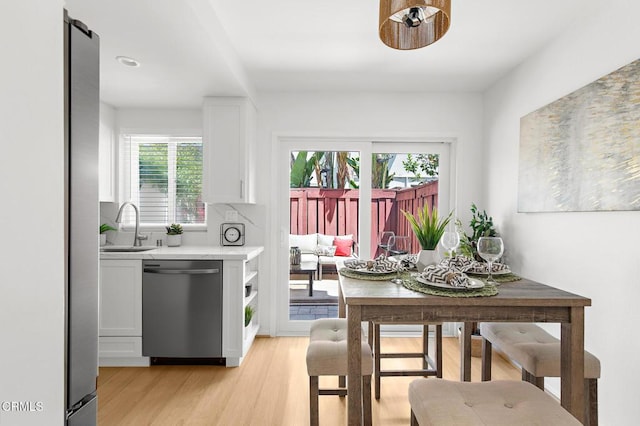 10801 Blix St Unit 2, Toluca Lake, CA 91602 - kitchen featuring dishwasher, white cabinetry, light countertops, and healthy amount of natural light