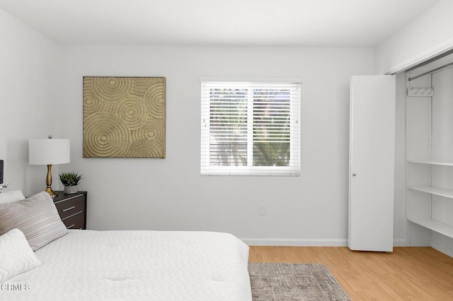 10801 Blix St Unit 2, Toluca Lake, CA 91602 - bedroom with light wood finished floors and baseboards