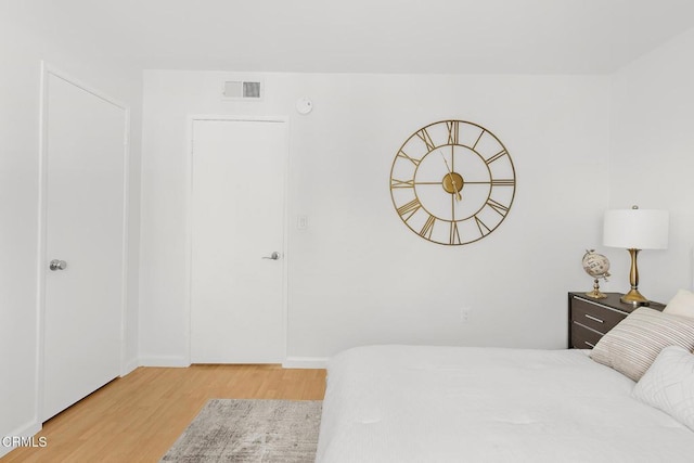 10801 Blix St Unit 2, Toluca Lake, CA 91602 - bedroom with light wood finished floors and baseboards