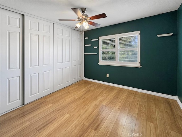 4787 Boardwalk Dr, Riverside, CA 92503 - unfurnished bedroom with light wood finished floors, baseboards, and a closet
