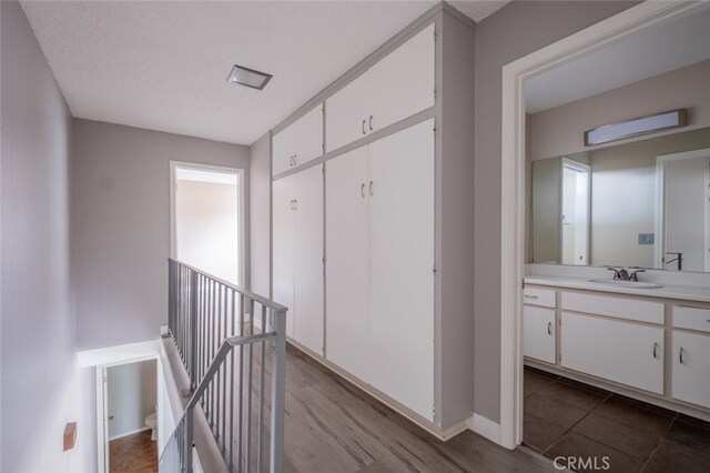 1341 N Keystone St, Burbank, CA 91506 - corridor with an upstairs landing and dark wood-style floors