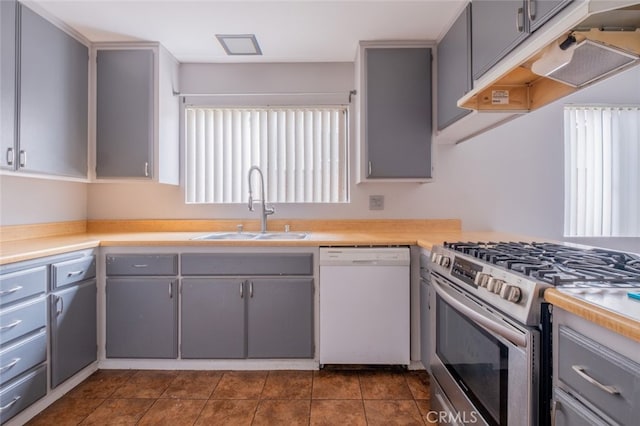 1341 N Keystone St, Burbank, CA 91506 - kitchen with white dishwasher, stainless steel range with gas cooktop, gray cabinetry, under cabinet range hood, and light countertops