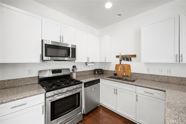 949 Humbert Ave, San Luis Obispo, CA 93401 - kitchen featuring appliances with stainless steel finishes, a sink, white cabinetry, recessed lighting, and dark wood-style floors