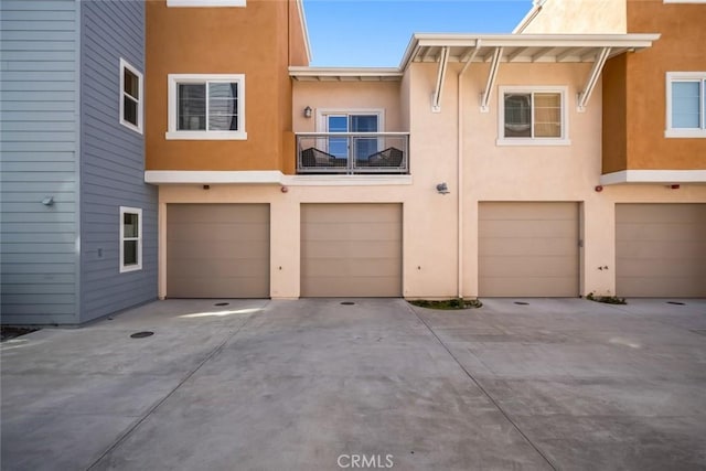 949 Humbert Ave, San Luis Obispo, CA 93401 - view of front facade with an attached garage, stucco siding, and driveway