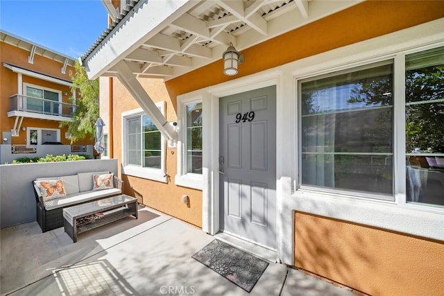 949 Humbert Ave, San Luis Obispo, CA 93401 - property entrance featuring stucco siding and outdoor lounge area